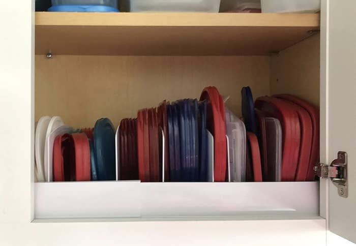 A lid organizer in a cabinet