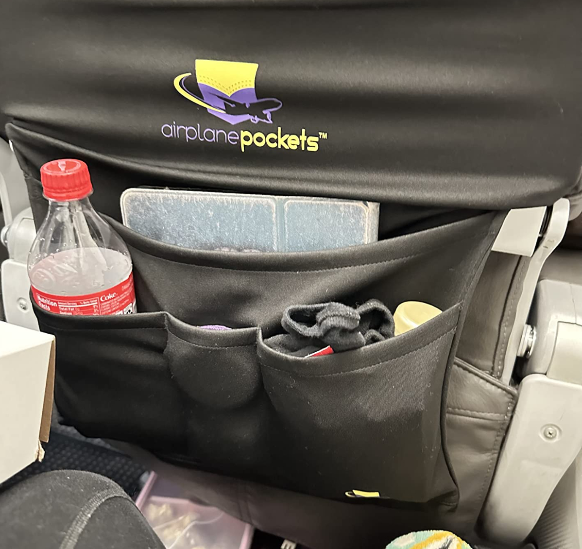 airplane pockets over an airline tray table