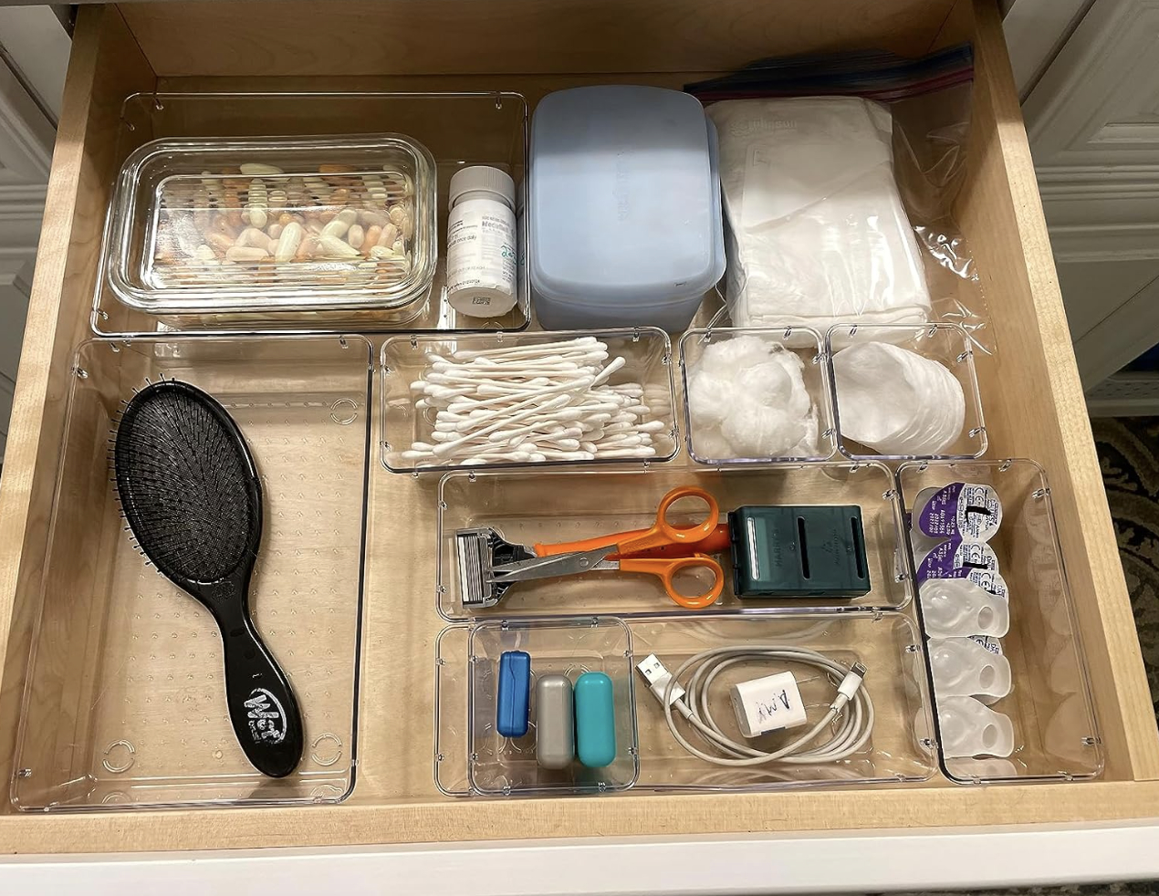 organized plastic drawer in a larger wooden drawer