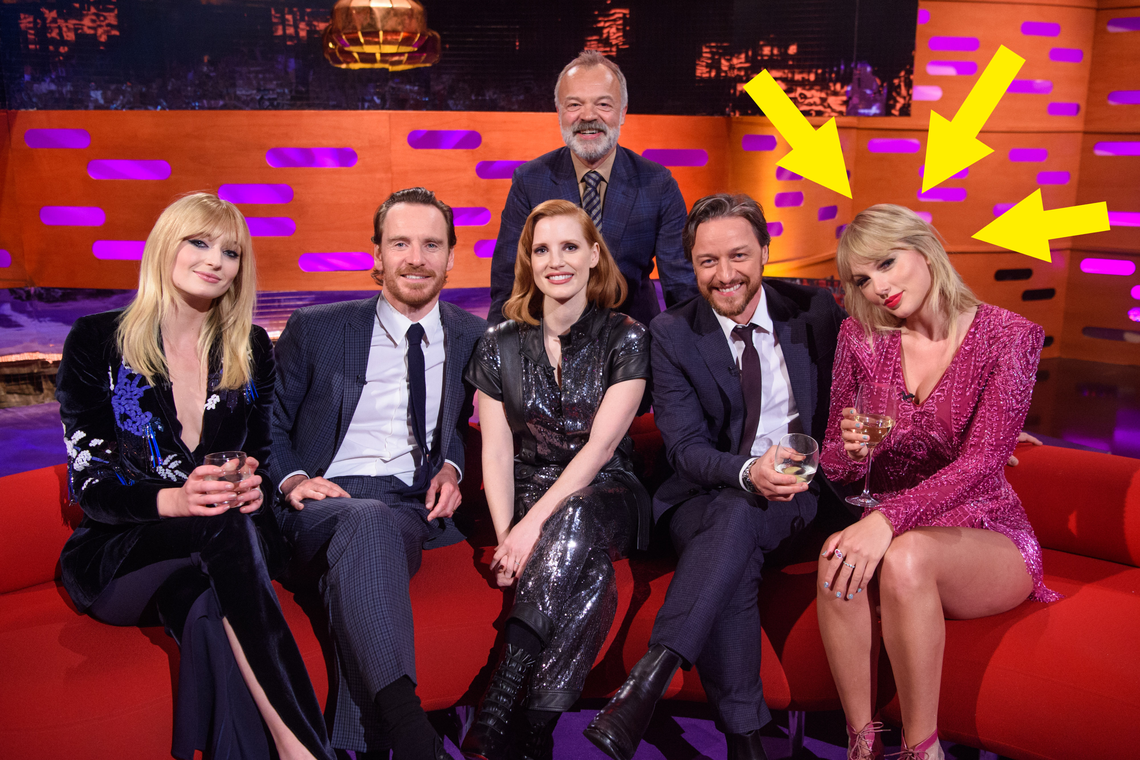 arrows pointing to taylor swift sitting with other celebs from a talk show, including sophie turner and jessica chastain