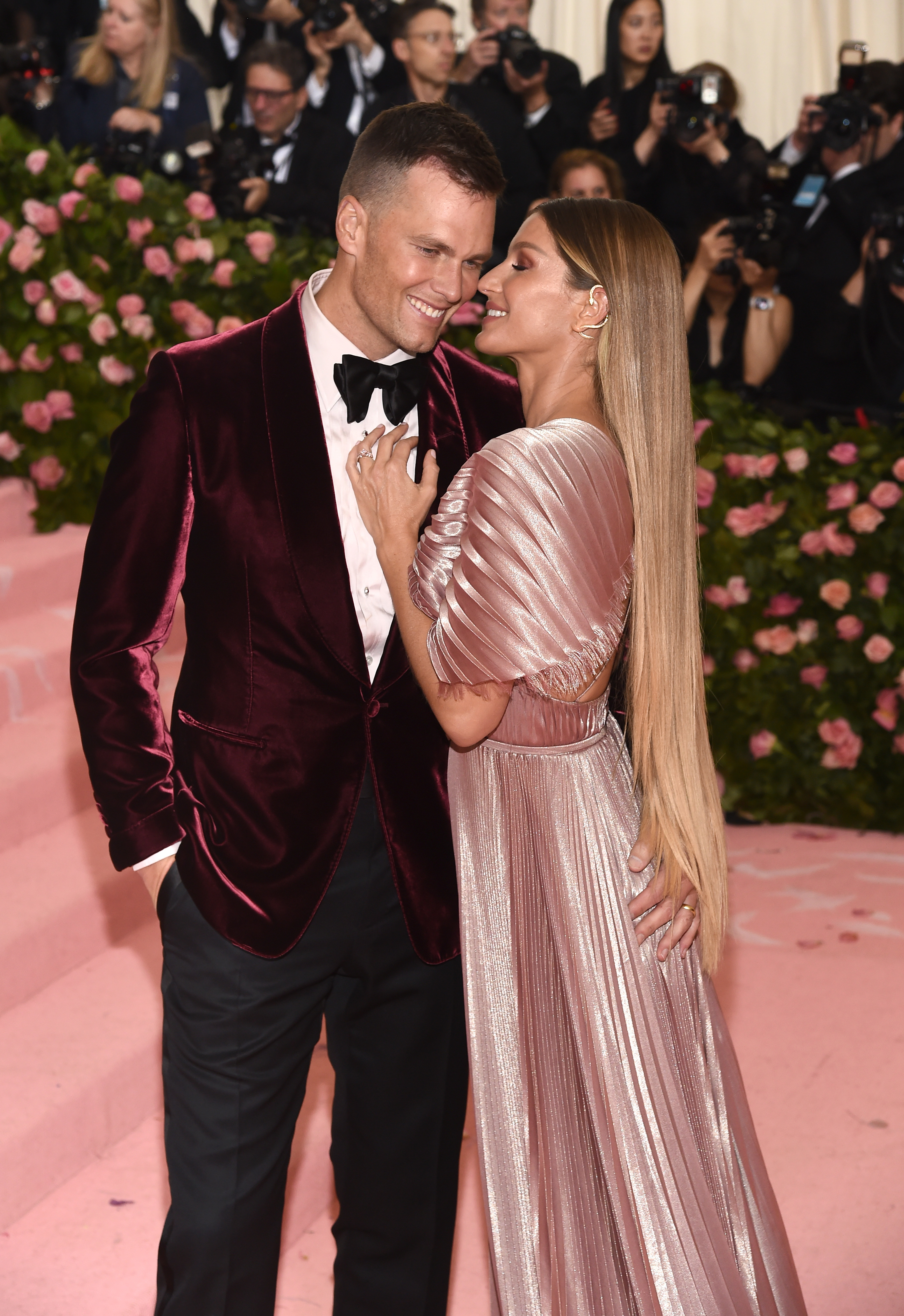 Gisele and Tom with arms around each other at the met gala