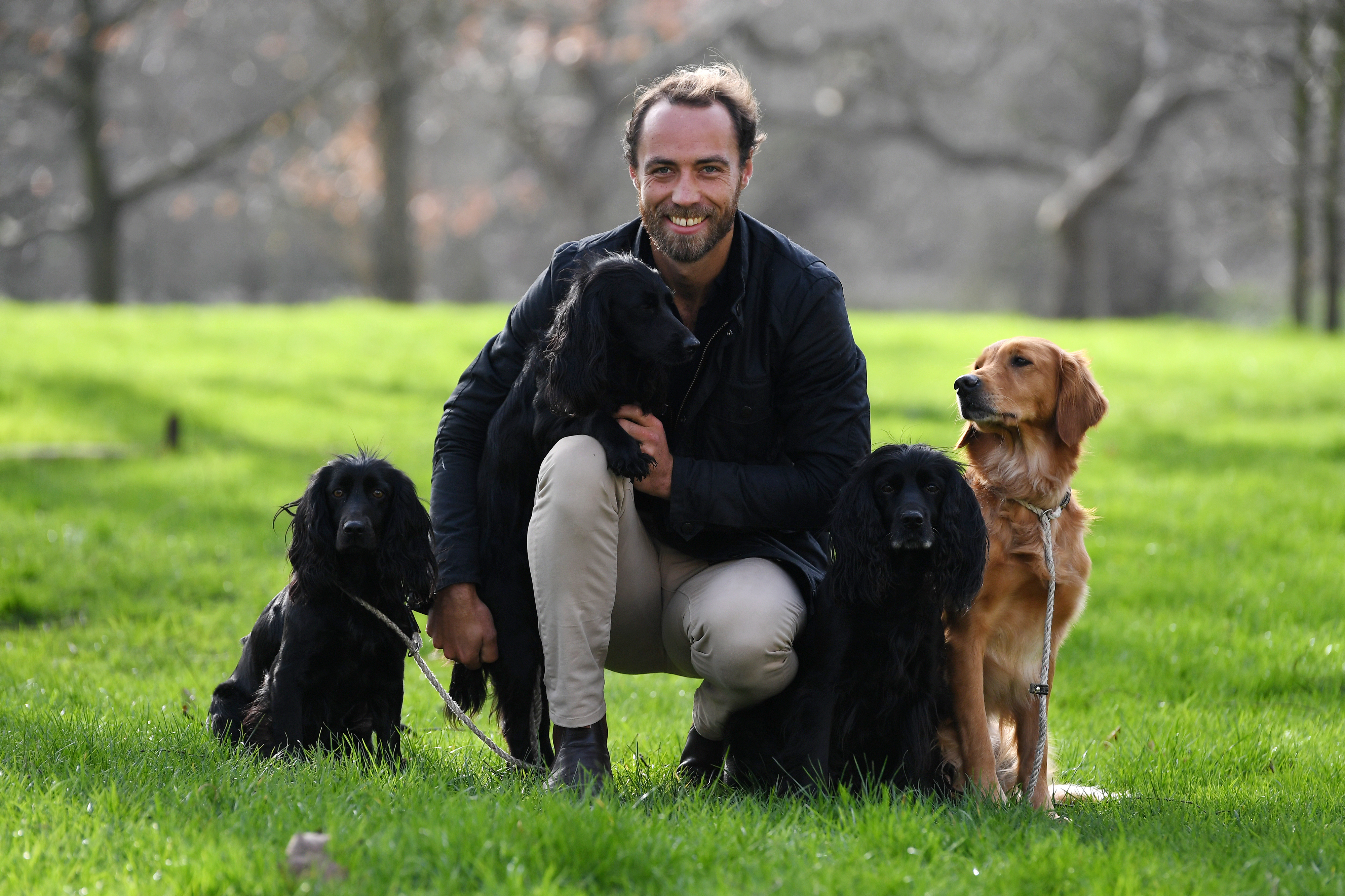 Closeup of James with his dogs outside