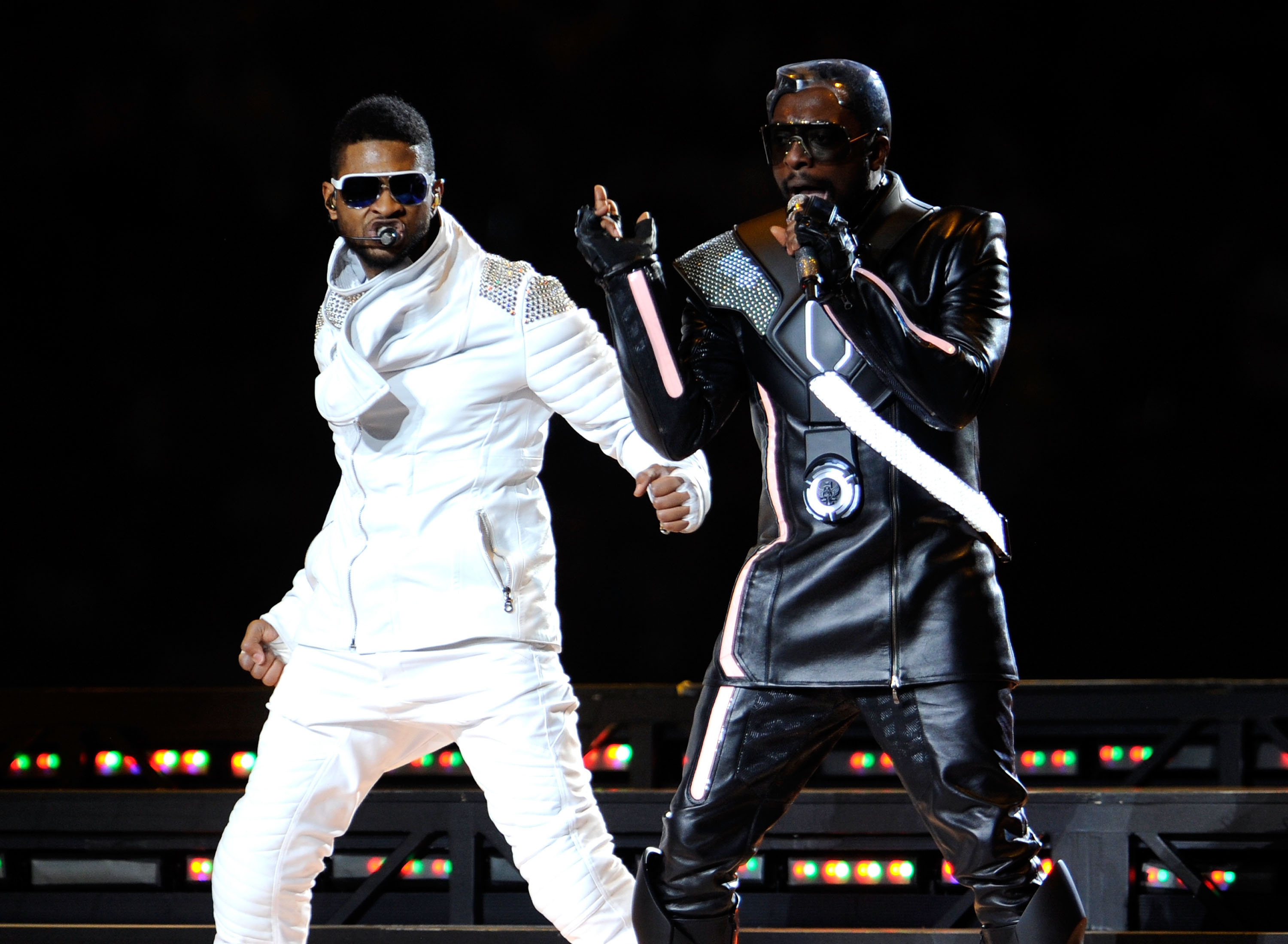 Usher onstage with The Black Eyed Peas