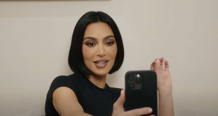 Close-up of Kim taking a selfie with her bob