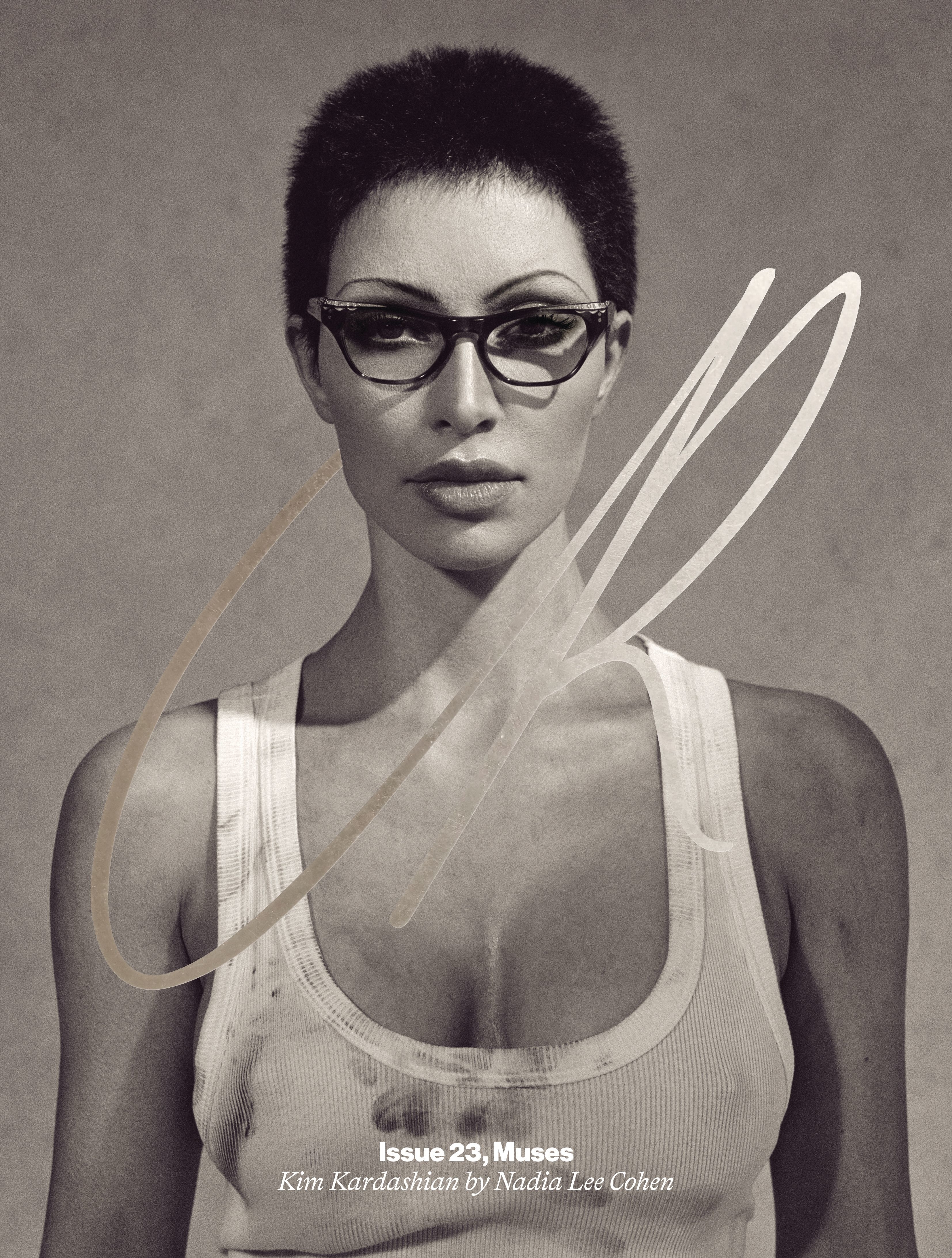 Close-up of Kim with a buzz cut and glasses. She&#x27;s wearing a dirty tank top