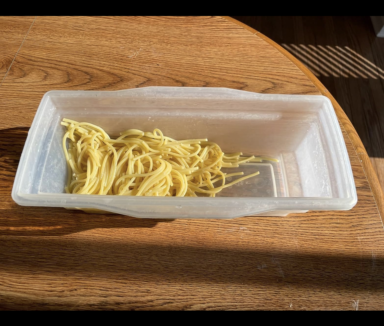 container with spaghetti in it