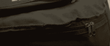 bag being zipped shut