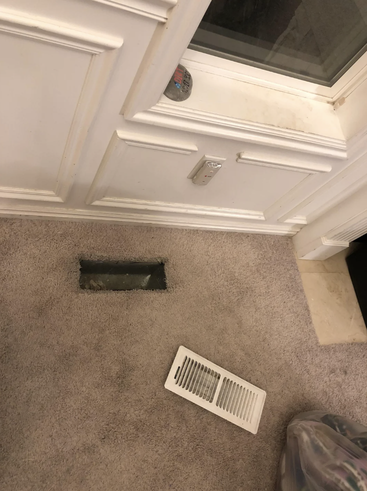 An uncovered vent in the floor