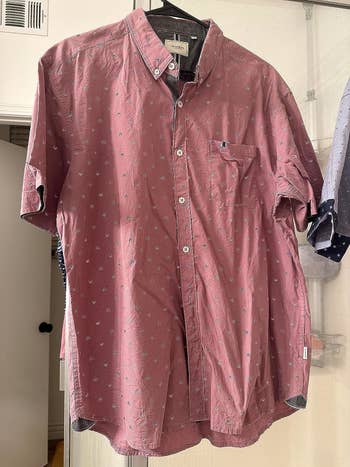a reviewer photo of a wrinkly button-up shirt 