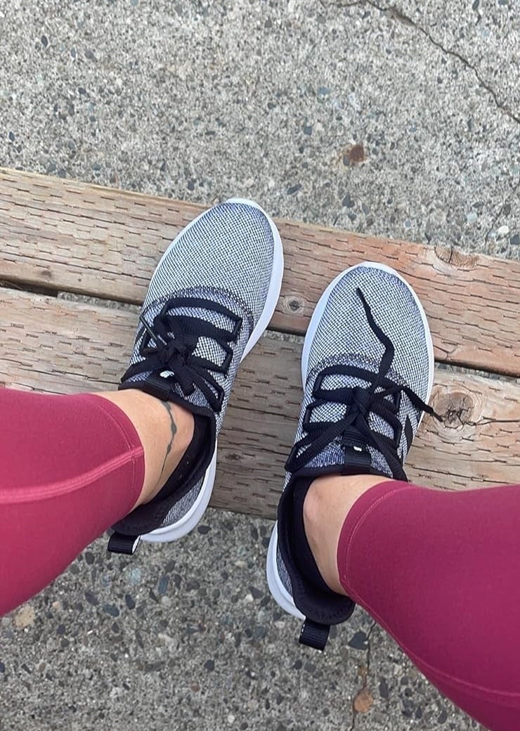 reviewer photo of gray adidas running shoes