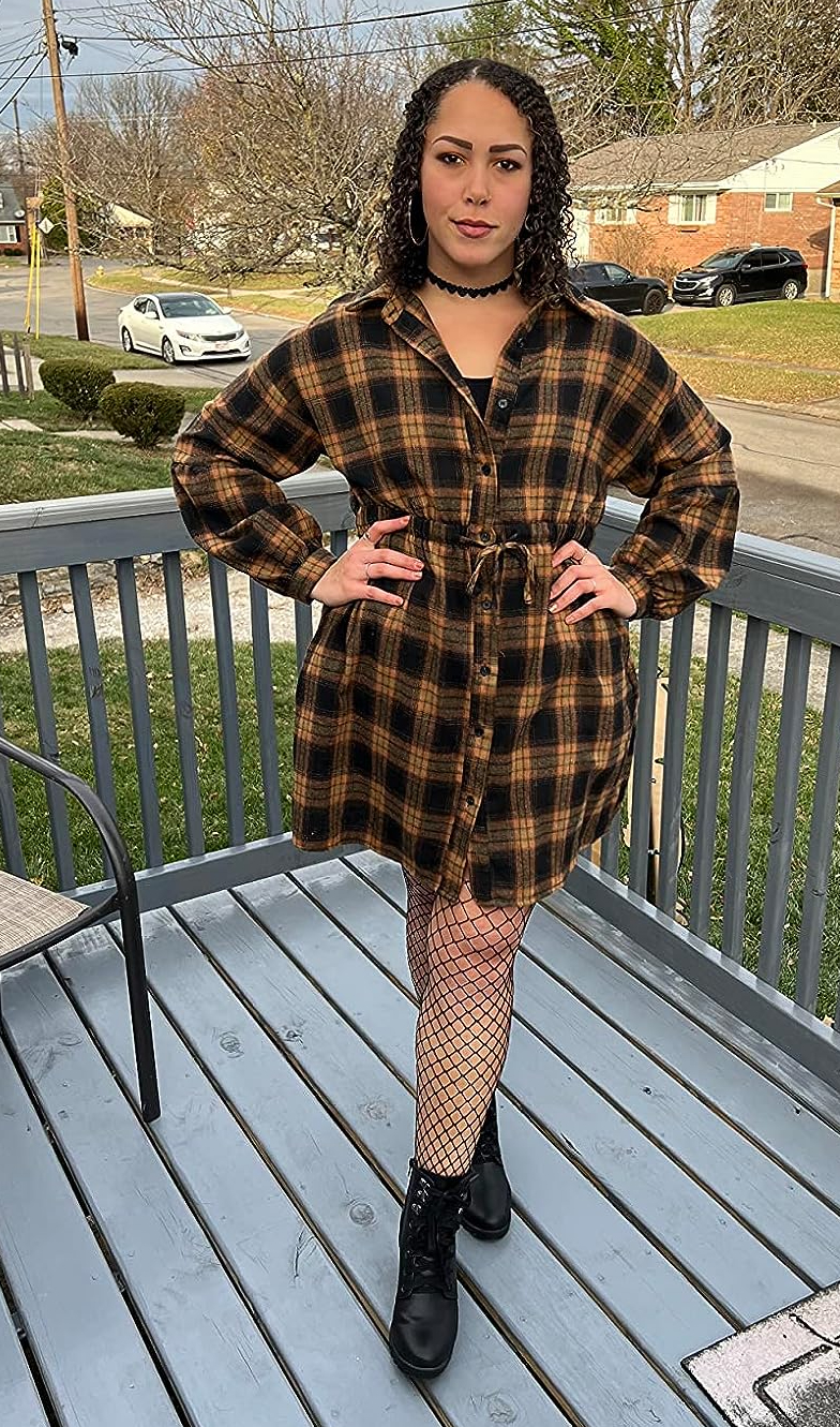 Reviewer wearing the brown plaid dress