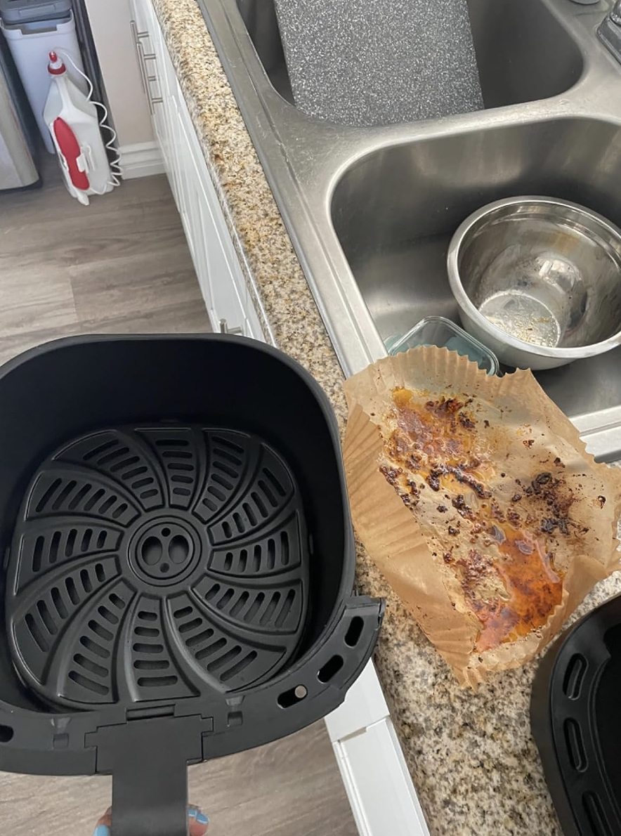 clean air fryer next to dirty liner