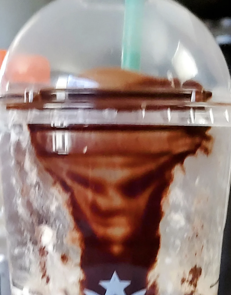 A face in someone&#x27;s coffee