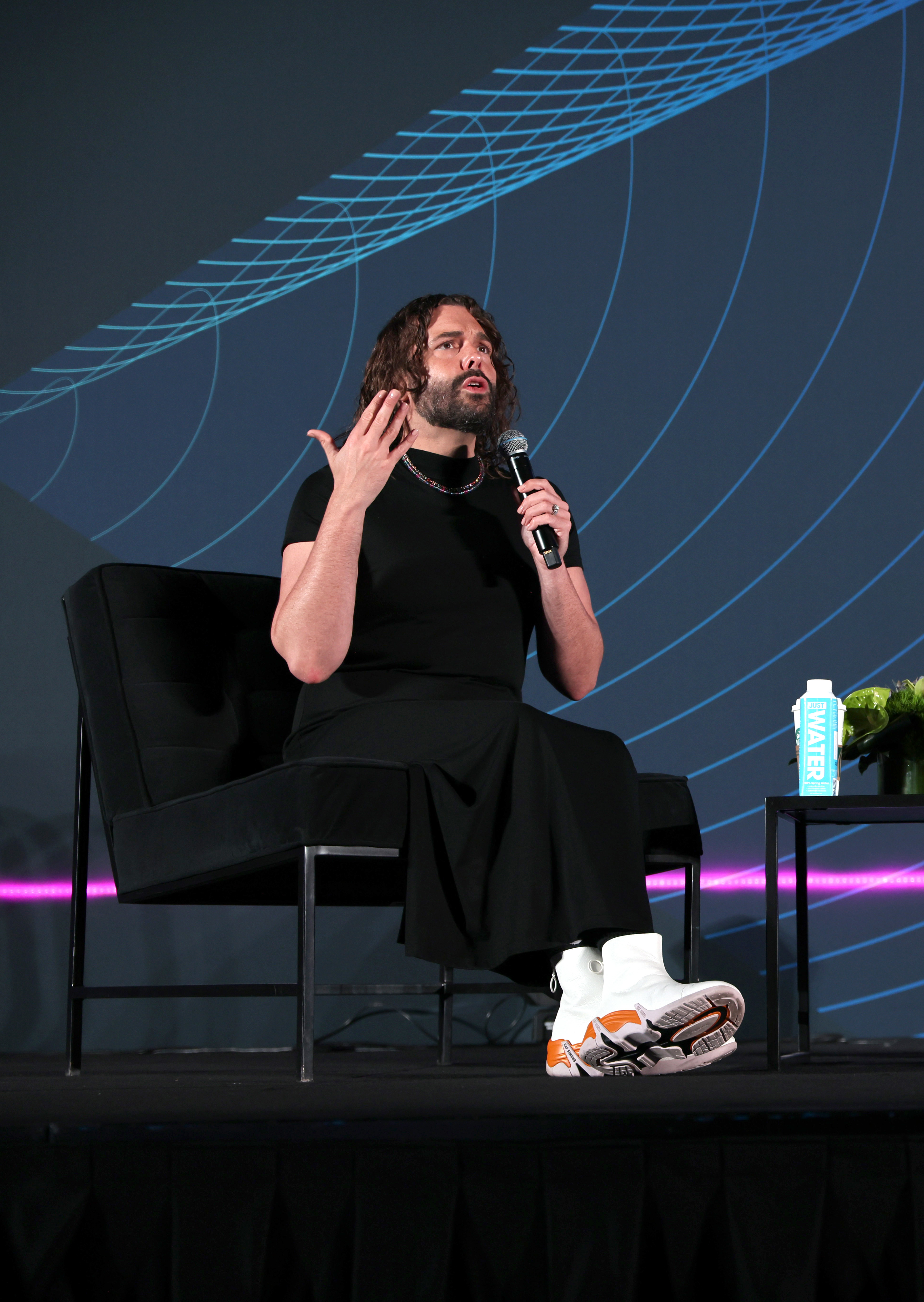 Jonathan Van Ness onstage during a talk