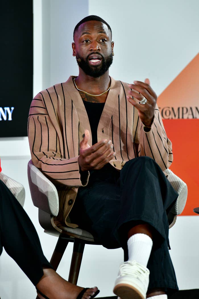 Closeup of Dwyane Wade sitting onstage and speaking during a panel