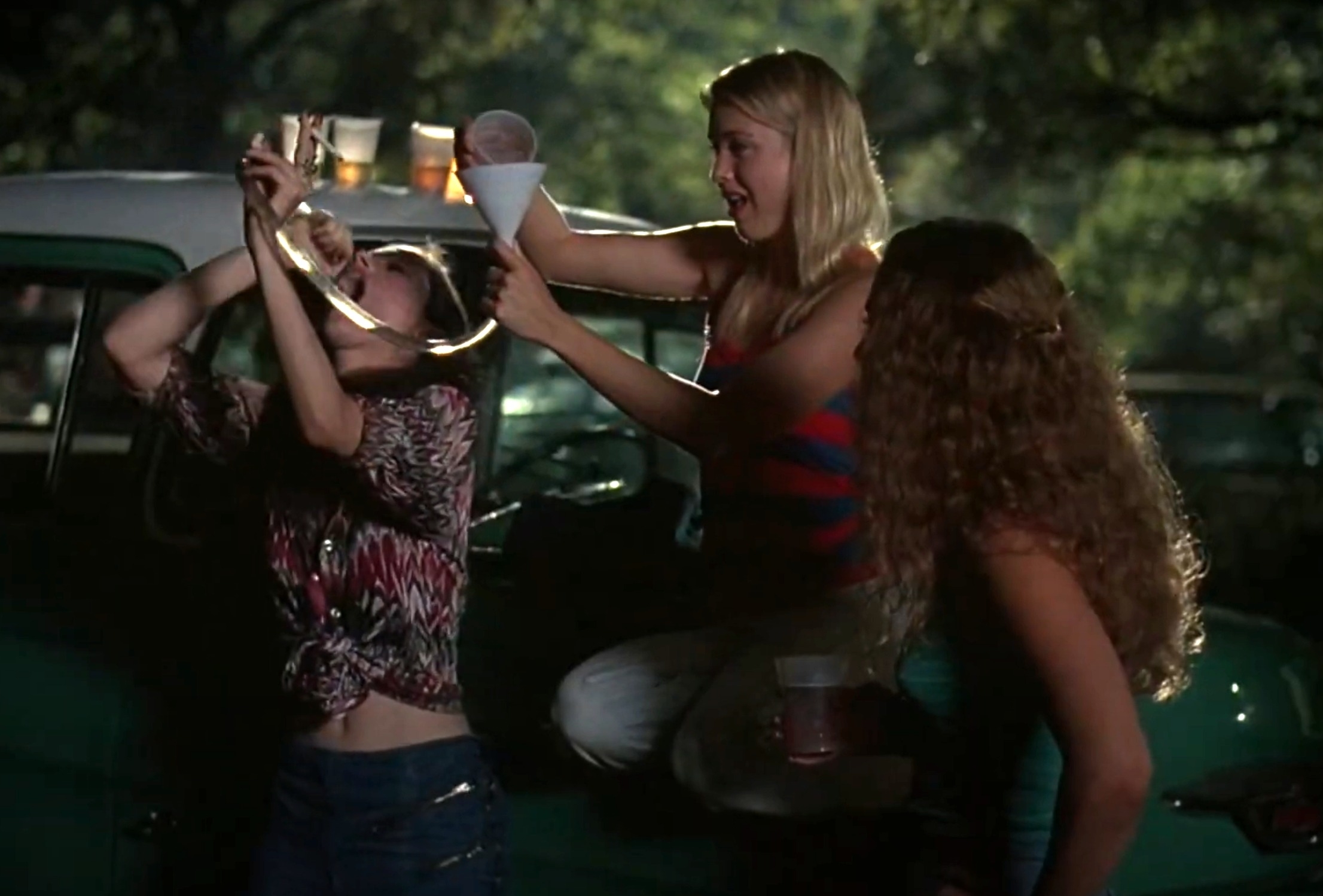 Renée pouring alcohol into a funnel attached to a tube