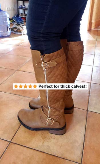 A reviewer wearing the boots in brown