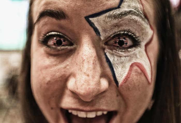Closeup of a woman with American flags and stars in her eyes