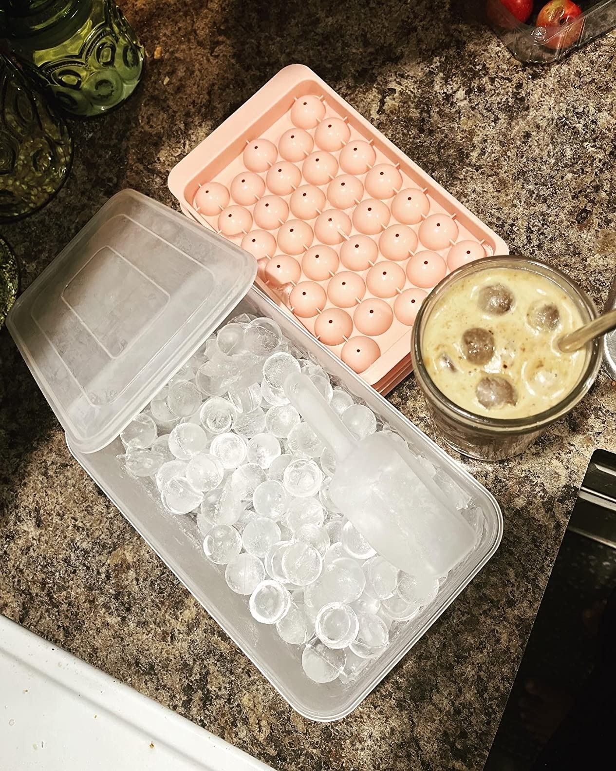 reviewer image of the circle ice tray and a drink with the ice cubes in it
