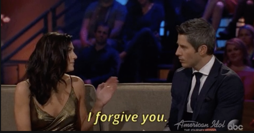 a woman saying, &quot;I forgive you&quot; to a man