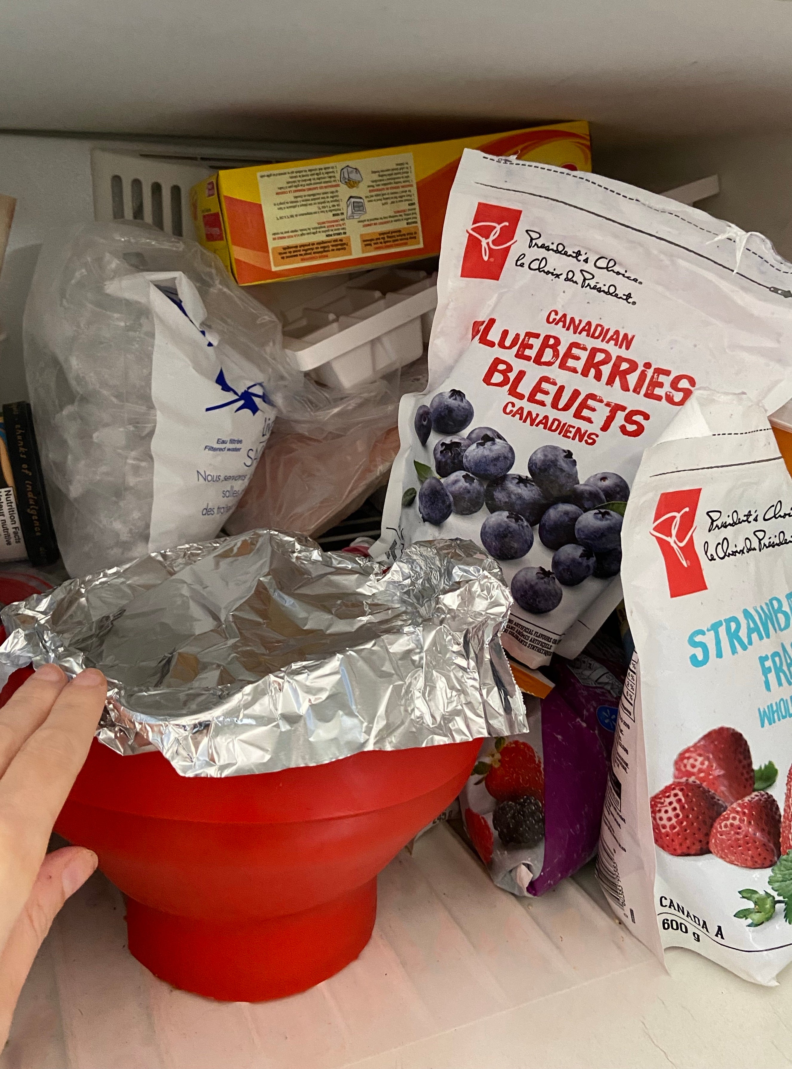 My bowl of watermelon chunks getting placed into the freezer