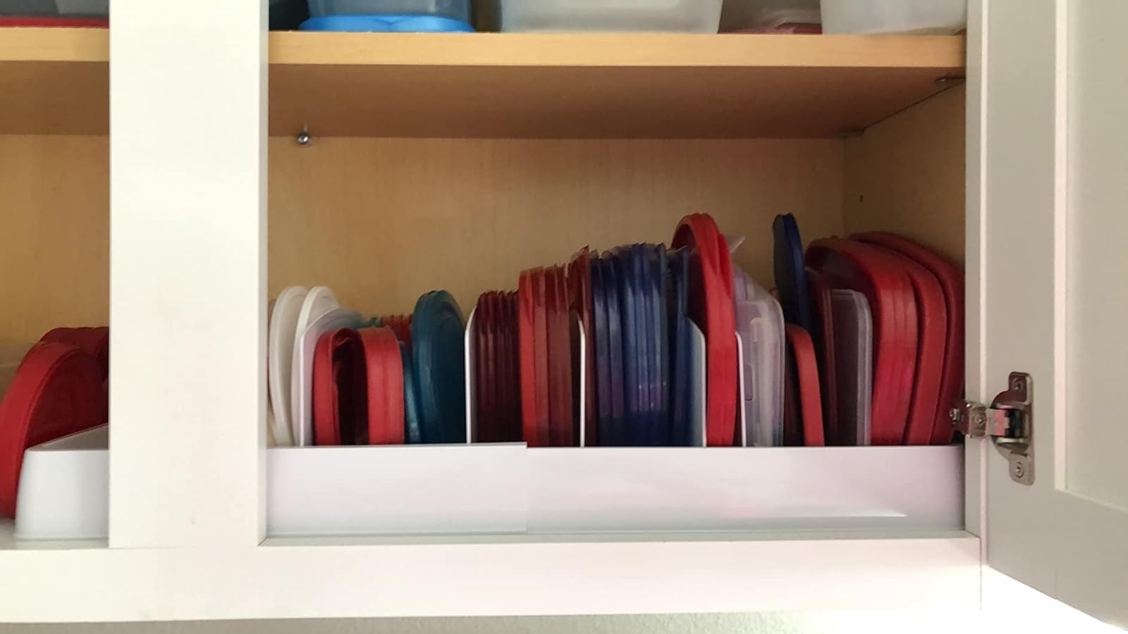 the lids organized in a reviewer cupboard