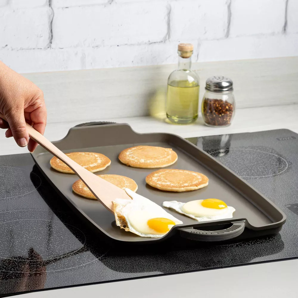 cast iron aluminum griddle with eggs and pancakes
