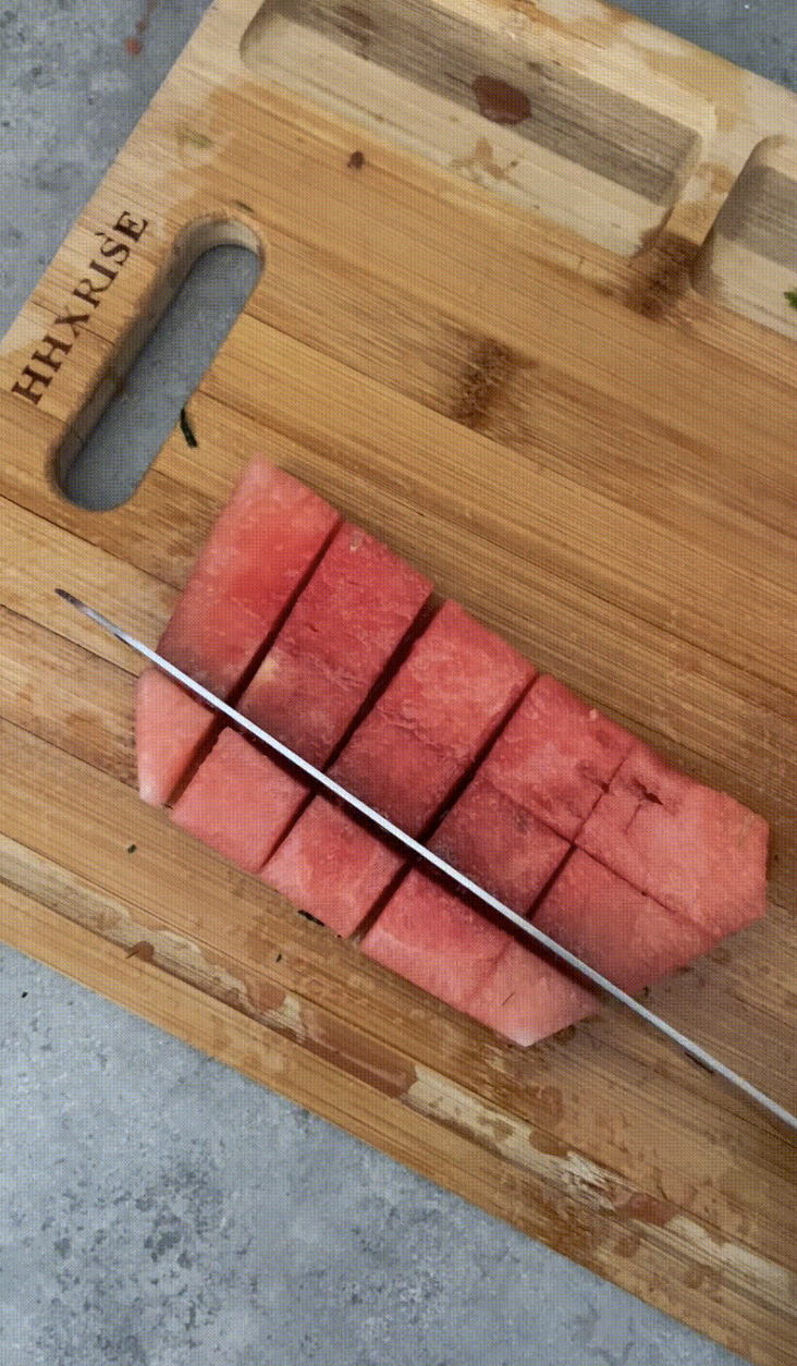 Cutting watermelon into chunks