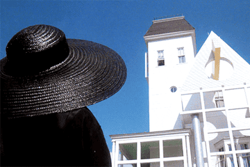 From "Beetlejuice": Winona Ryder's character looks up at a huge old house, then turns to give a confused look