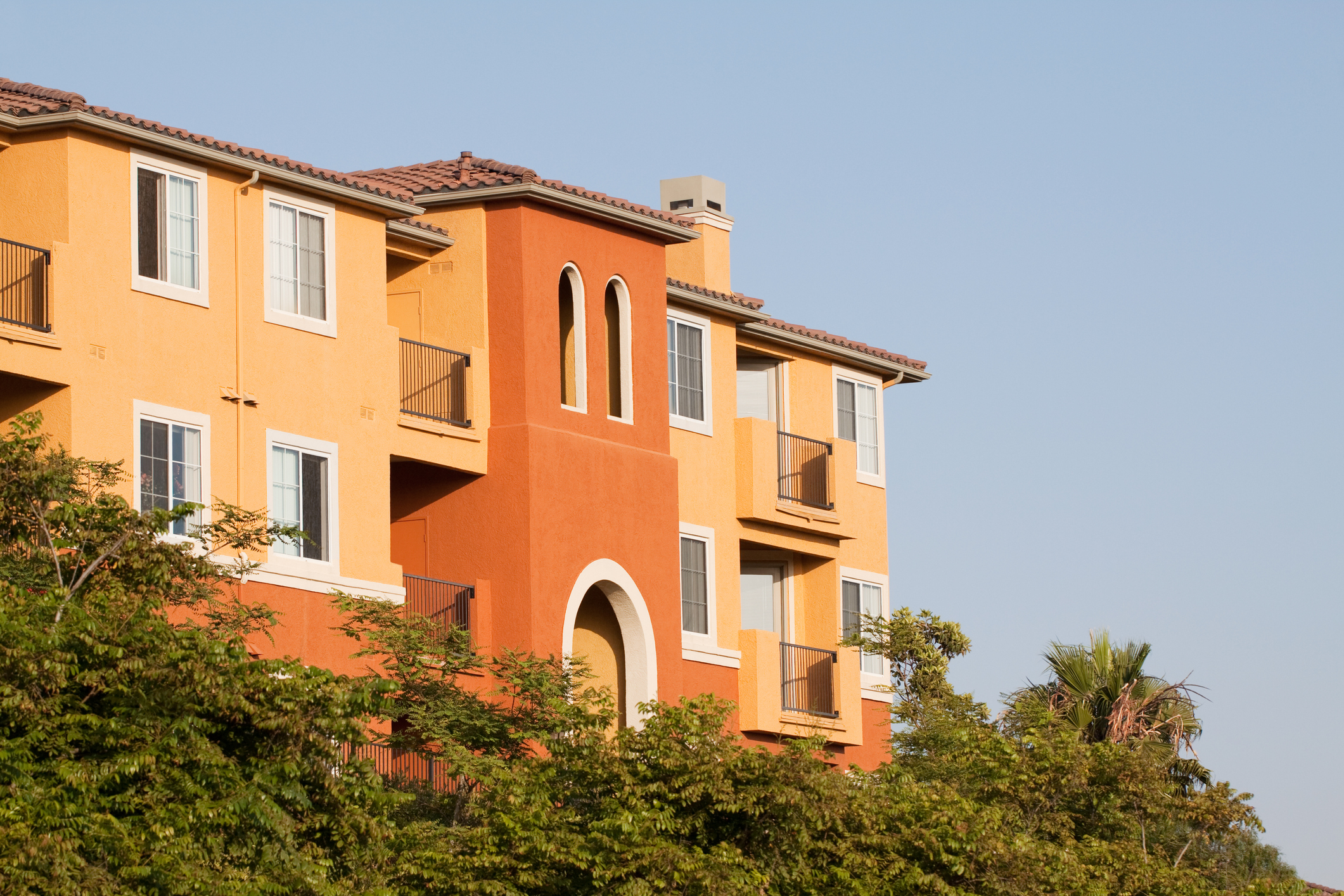 An apartment building bathed in sunlight