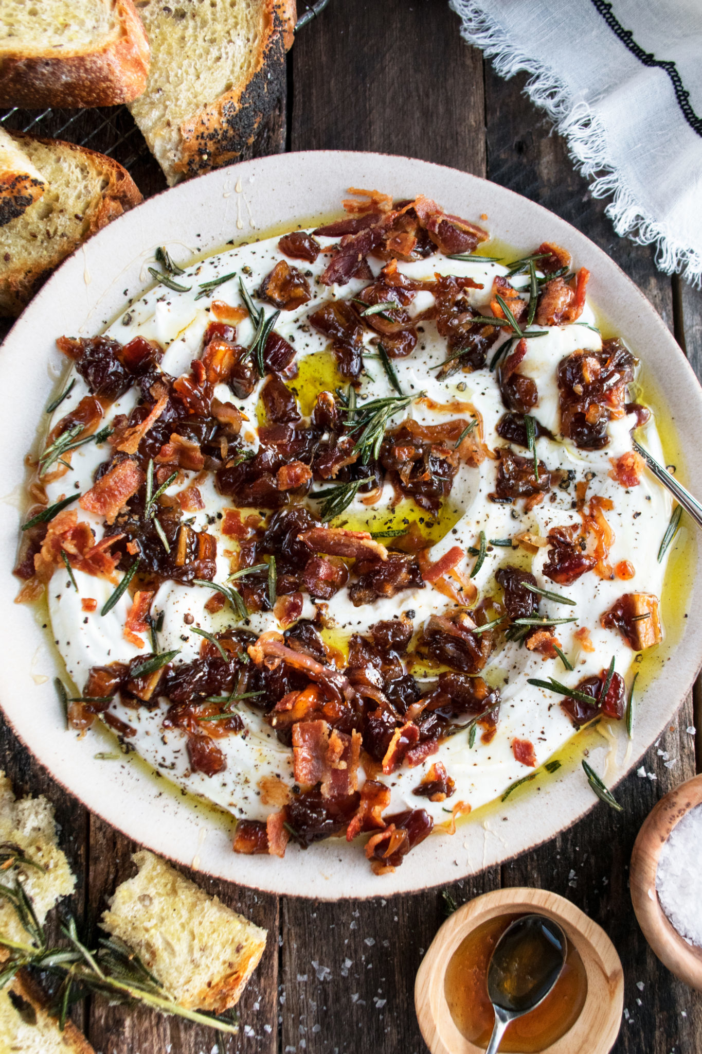 Whipped Goat Cheese with Bacon and Dates in a shallow serving bowl