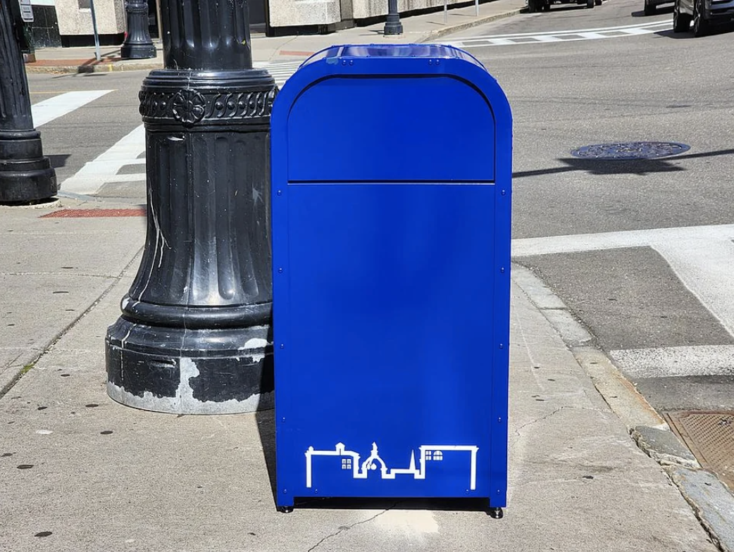 A trash can that looks like a mailbox