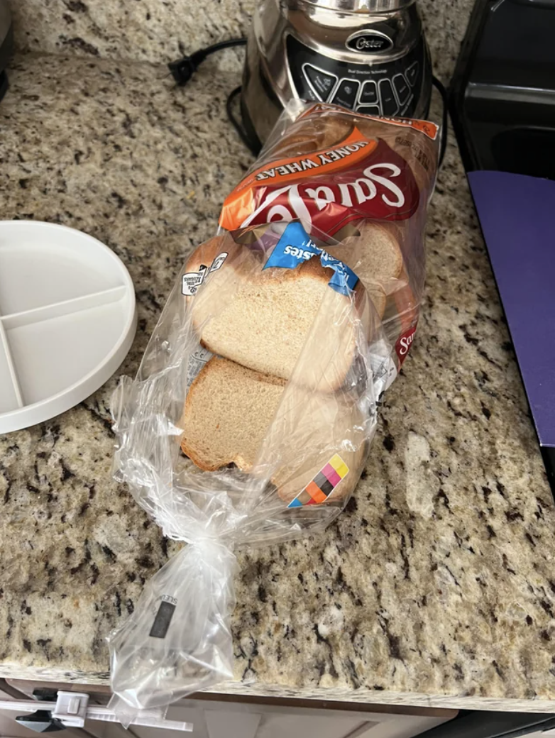 a rip through the bag instead of it being opened at the twist tie end