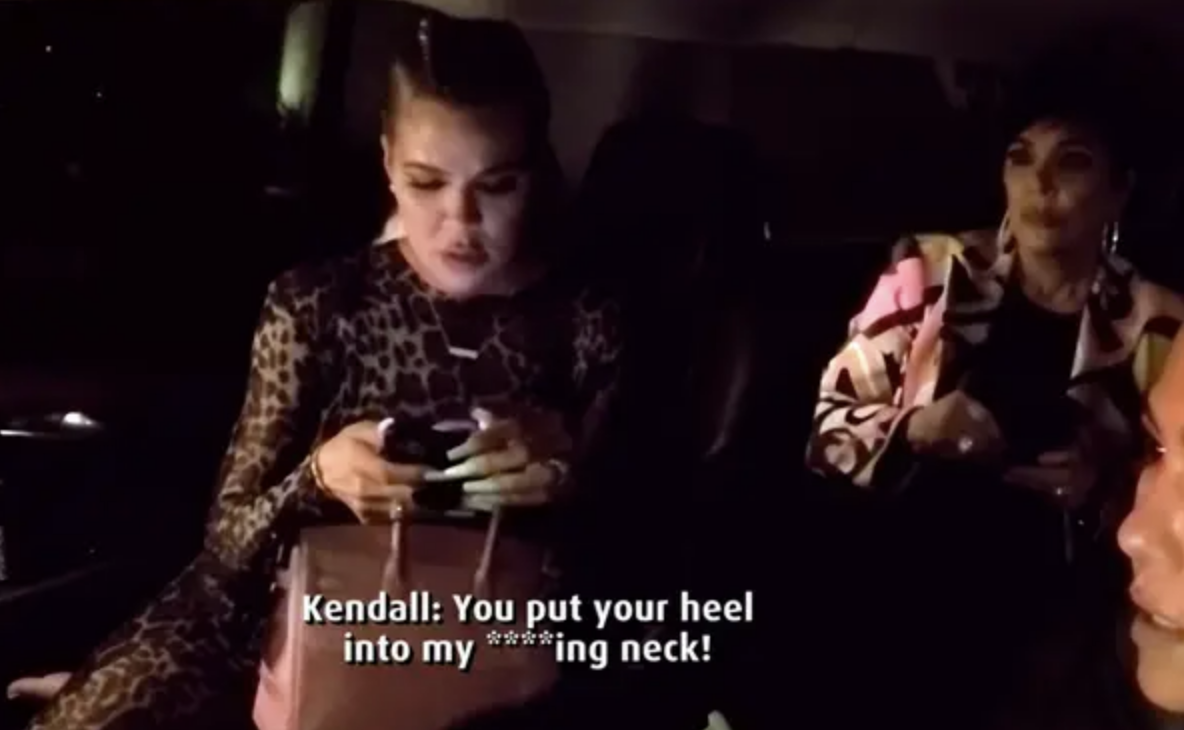 Khloé reading her phone with caption &quot;Kendall: You put your heel into my ***ing neck!&quot;