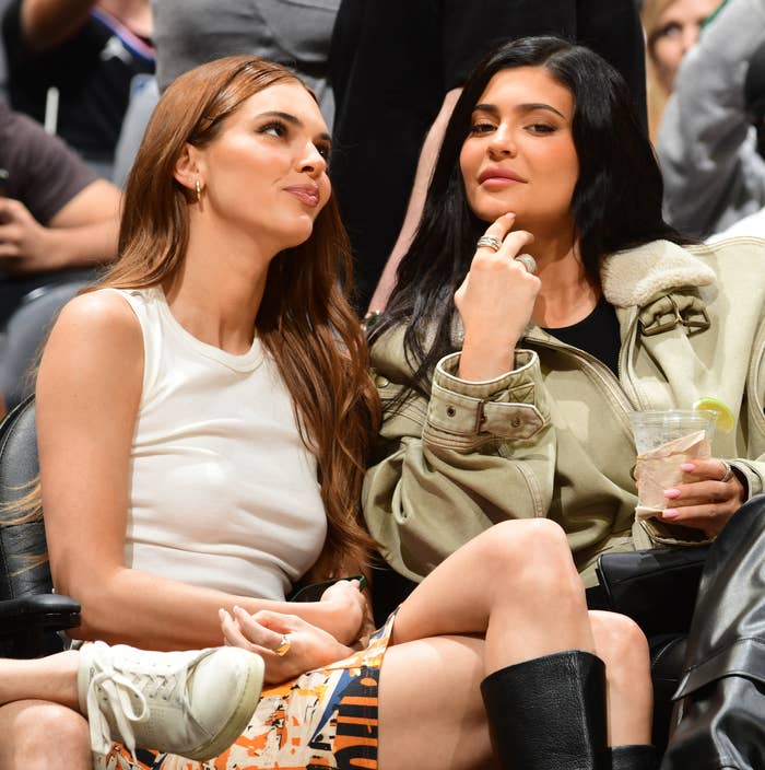 Kendall and Kelly sitting together in the audience of a sports event