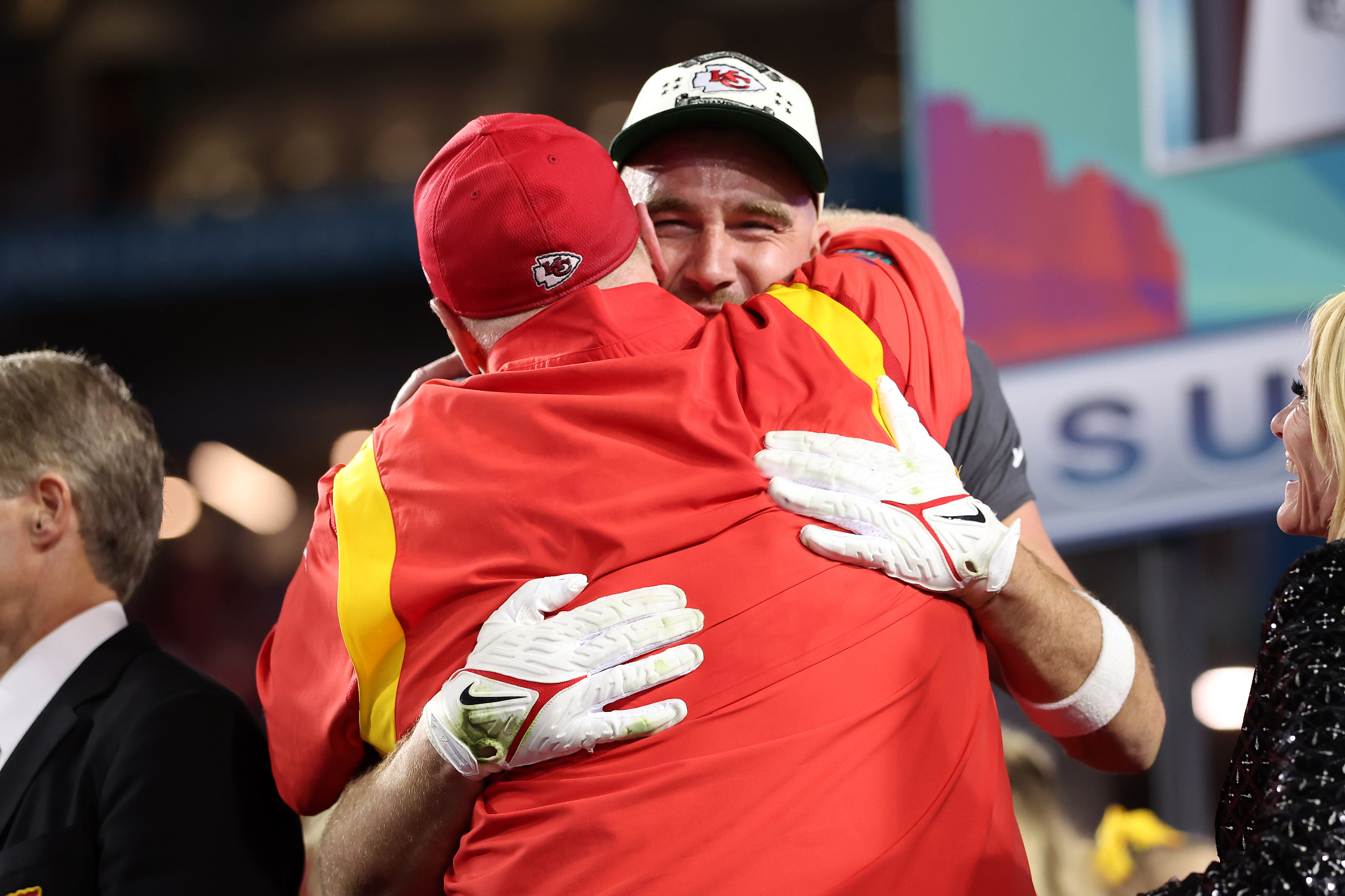 travis and coach reid hugging