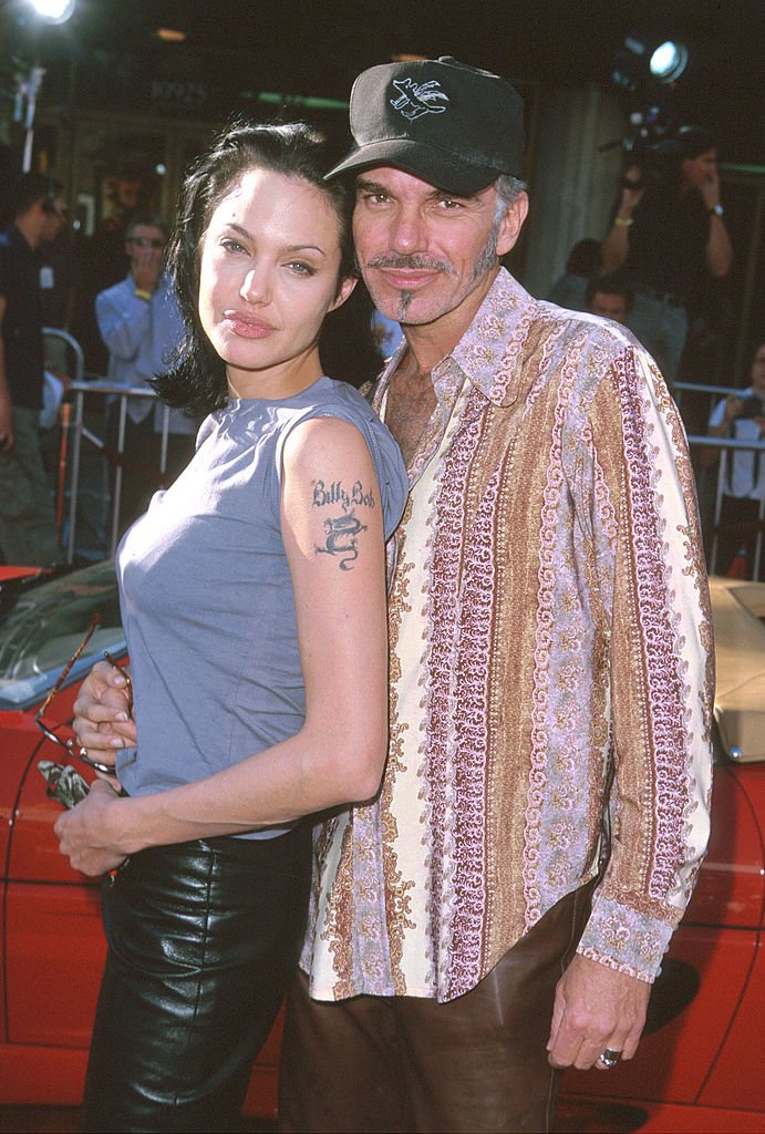 closeup of the two in leather pants and angelina&#x27;s billy bob tattoo