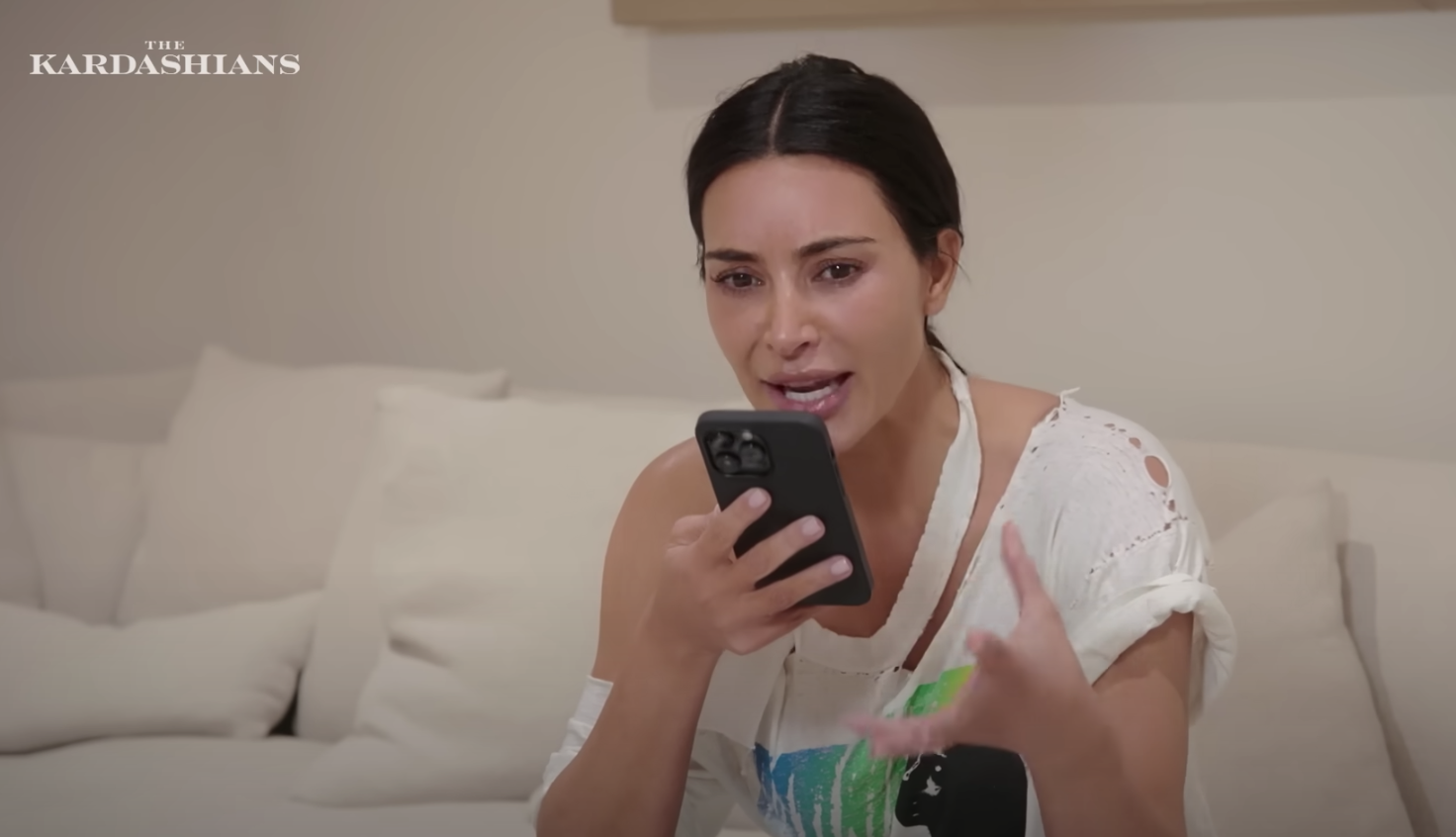 Kim talking into a phone