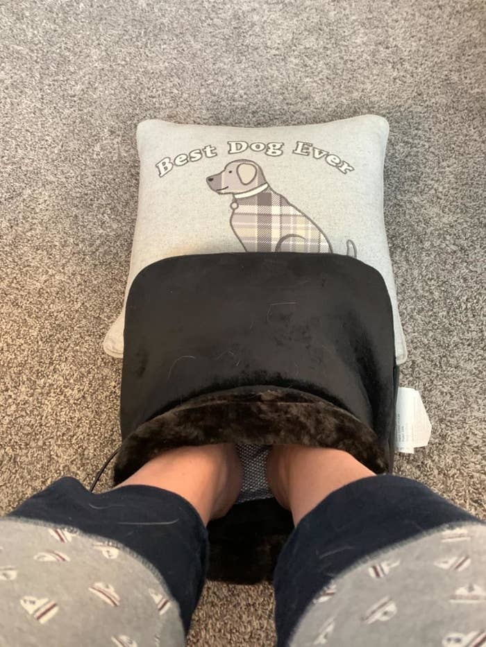 Reviewer with their feet inside the massager