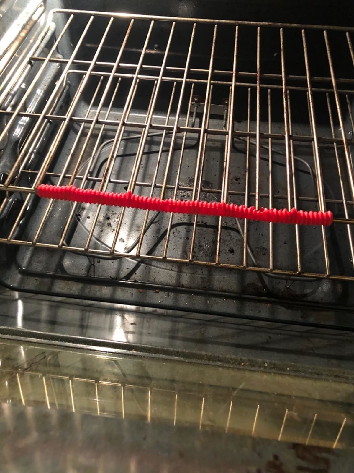 Reviewer image of the red guard on an oven rack