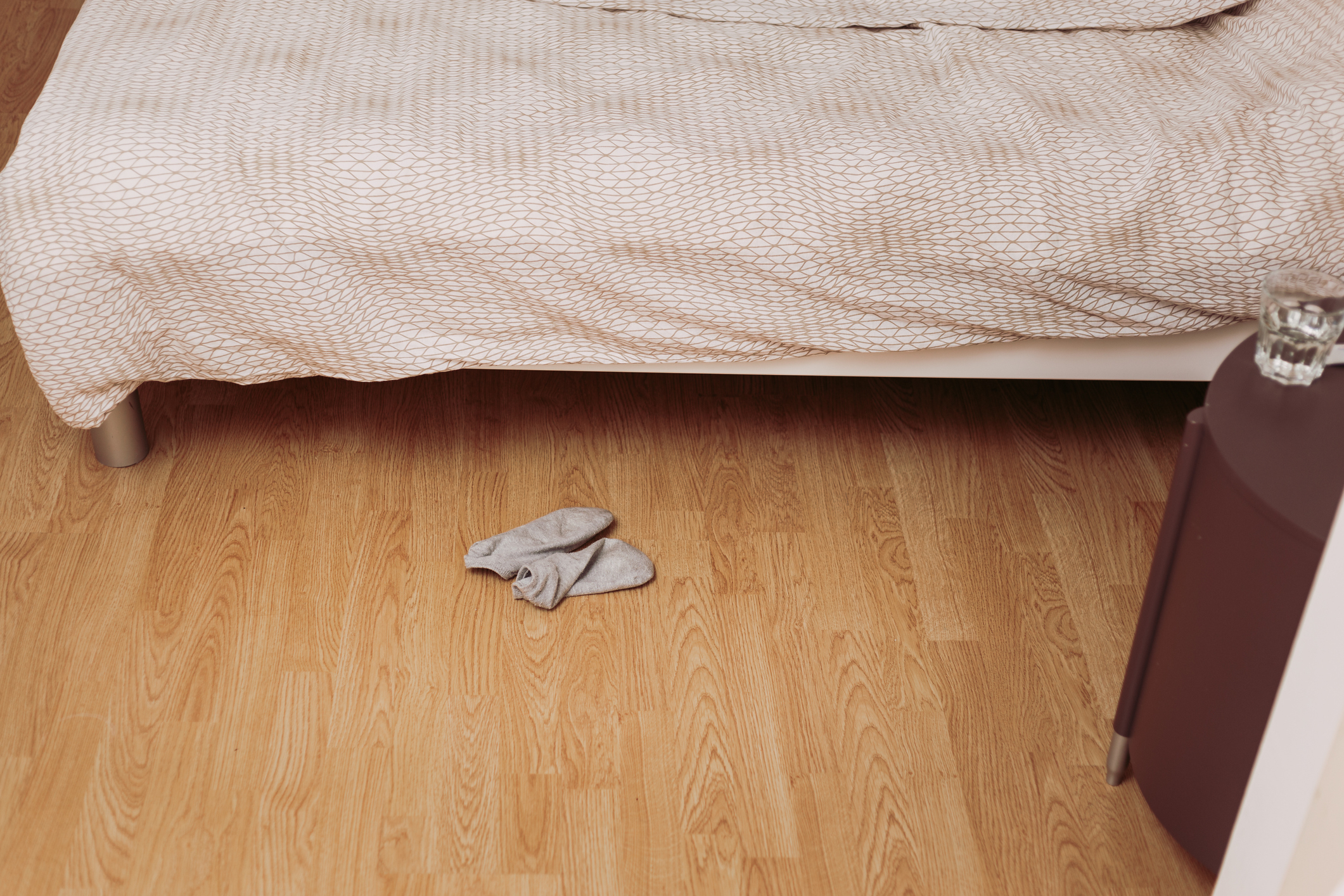 Dirty socks on a bedroom floor