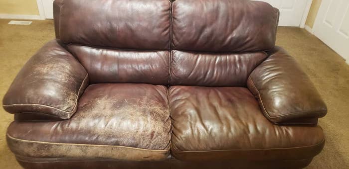 Reviewer image of their leather couch with the right side treated with the conditioner
