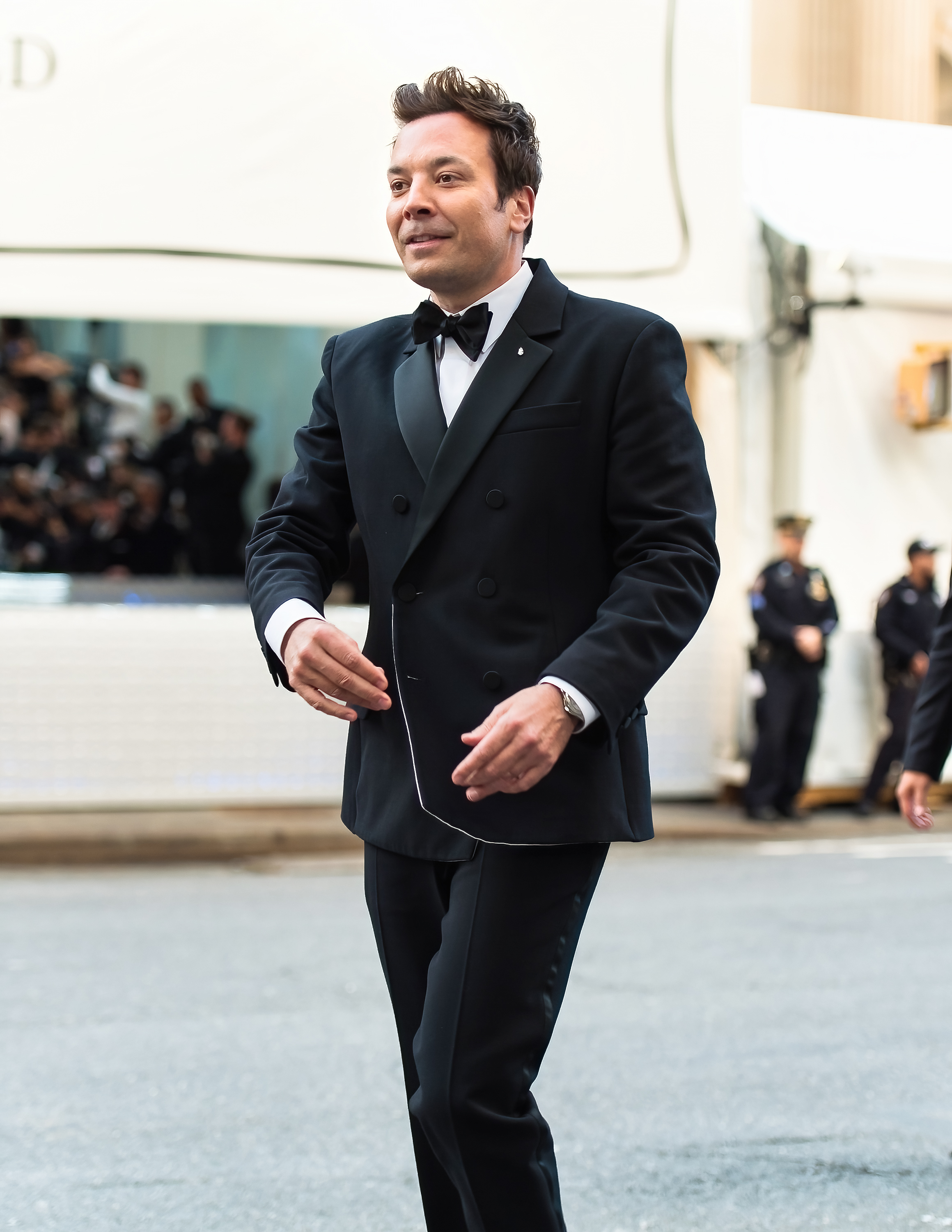 jimmy walking outside in a suit