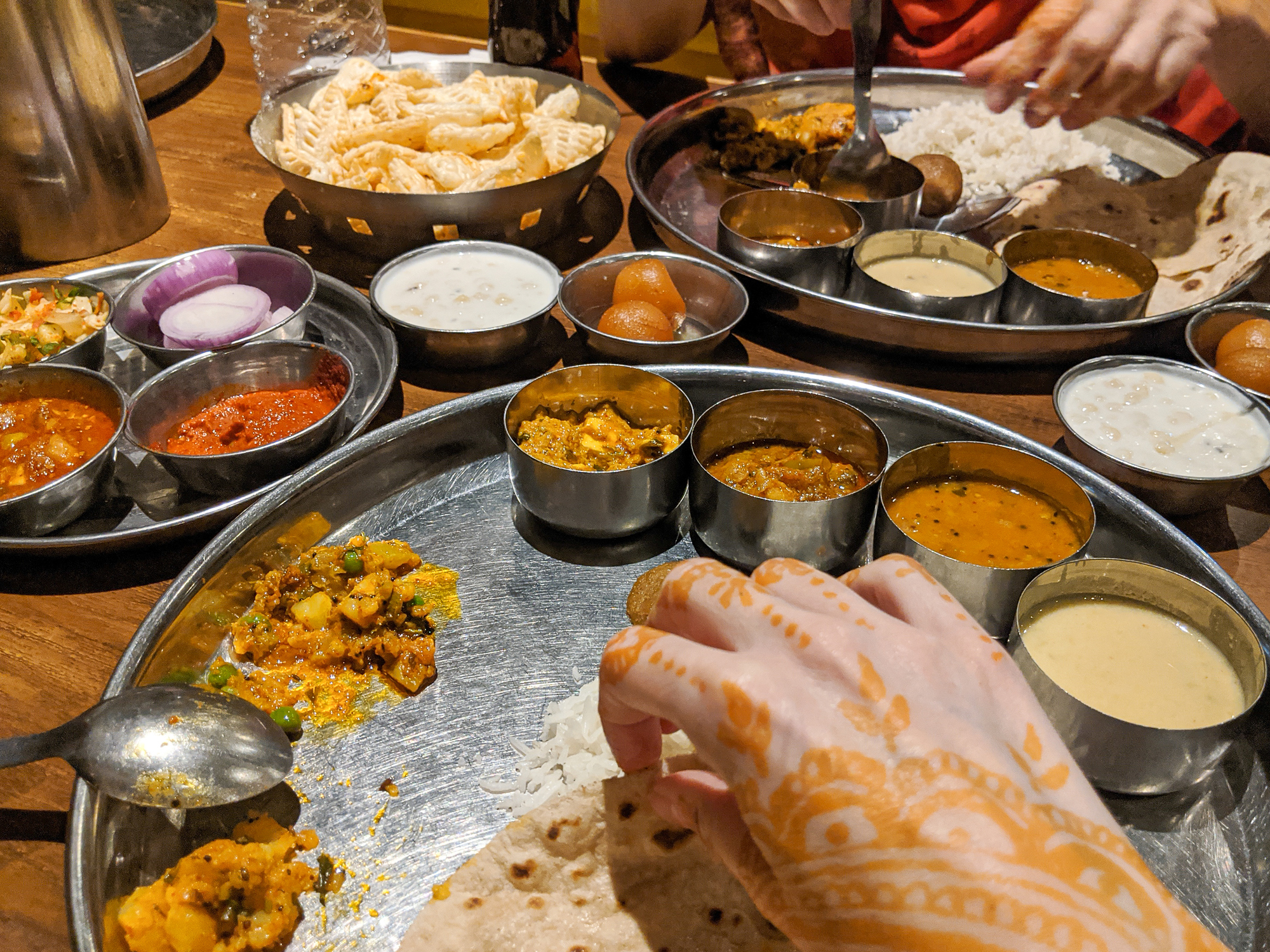A traditional Indian meal is being enjoyed