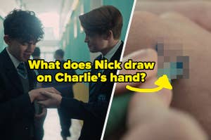 Nick holding Charlies hand and drawing on it.