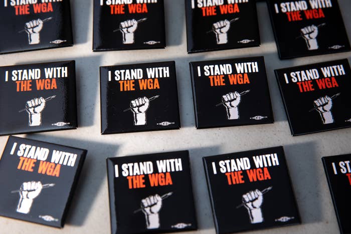 Pins that say &quot;I Stand with the WGA&quot;