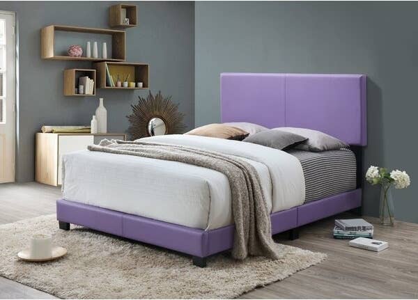 Purple bed frame in a room