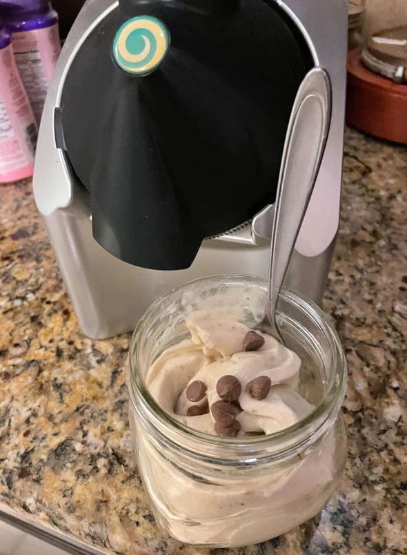a reviewr photo of yonanas ice cream maker and a jar of vegan ice cream