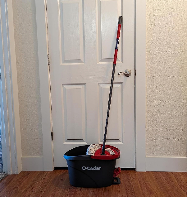 a reviewer photo of an oc cedar mop in the home