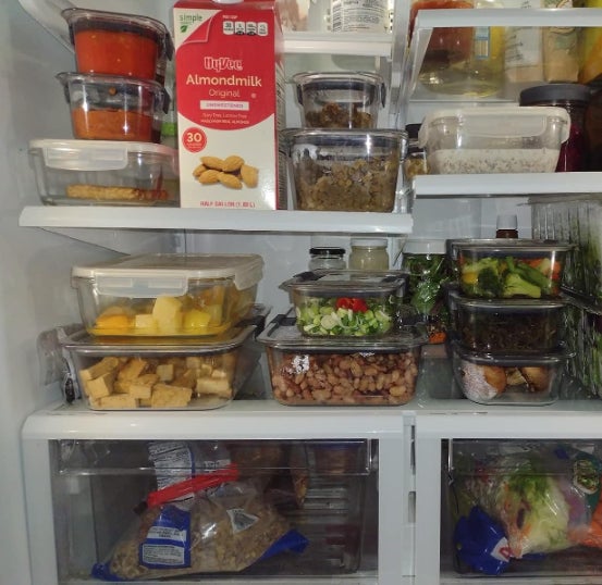 reviewer photo of many rubbermaid containers in a fridge